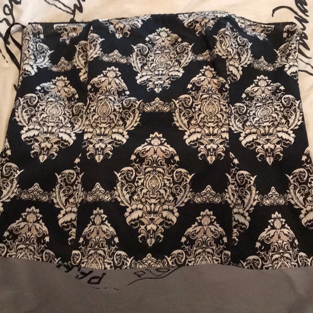 Black; tan and white strapless top